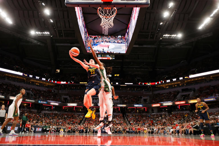 Clark drives to the hoop in Indianapolis against the Seattle Storm on Aug. 18 David E. Klutho—Sports Illustrated/Getty Images