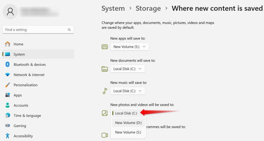 Changing the location where new photos and videos will be installed in the Windows Settings app.