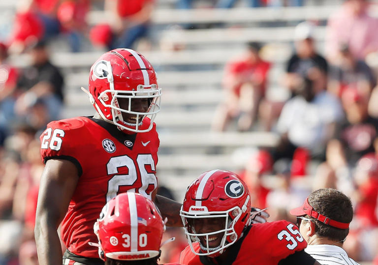 Georgia outside linebacker Damon Wilson Jr. (35) celebrates with Georgia outside linebacker Samuel M'Pemba (26) and Georgia inside linebacker Terrell Foster (30) aft getting a sack during the UGA G-Day spring football game at Sanford Stadium in Athens, Ga., on Saturday, April 15, 2023. Red won 31-26.  News Joshua L Jones