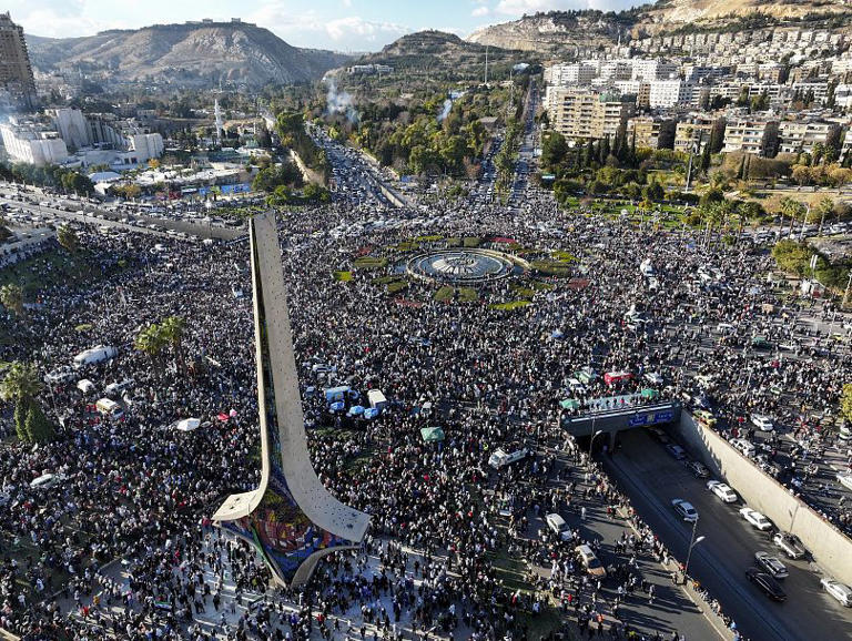 Syrians gather during a celebratory demonstration following the first Friday prayers since Bashar al-Assad's ouster in Damascus, 13 December, 2024 Ghaith Alsayed/Copyright 2024 The AP. All rights reserved.