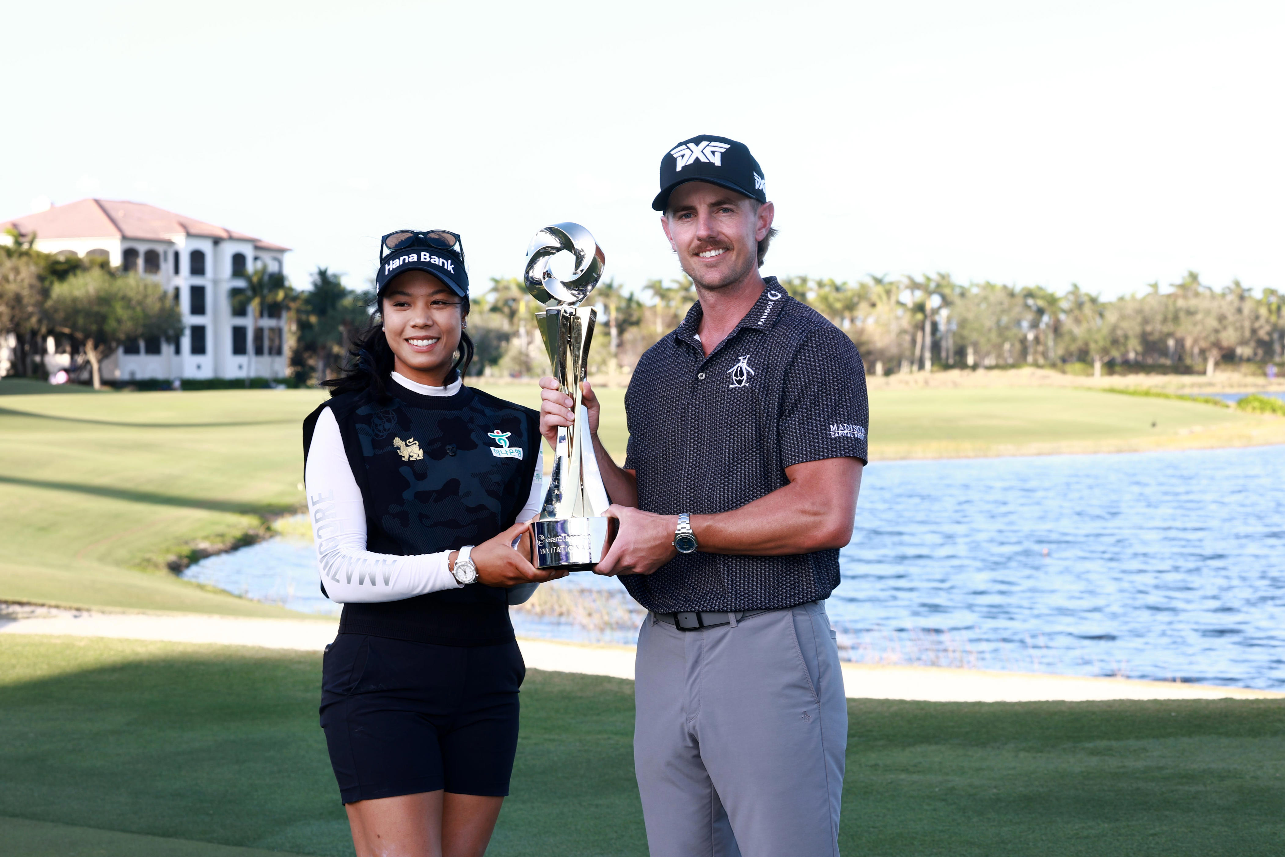 Patty Tavatanakit of Thailand and Jake Knapp of the United States pose with the trophy on the 18th green after winning the Grant Thornton Invitational 2024 at Tiburon Golf Club on Dec. 15, 2024 in Naples, Florida. (Carmen Mandato/Getty Images)