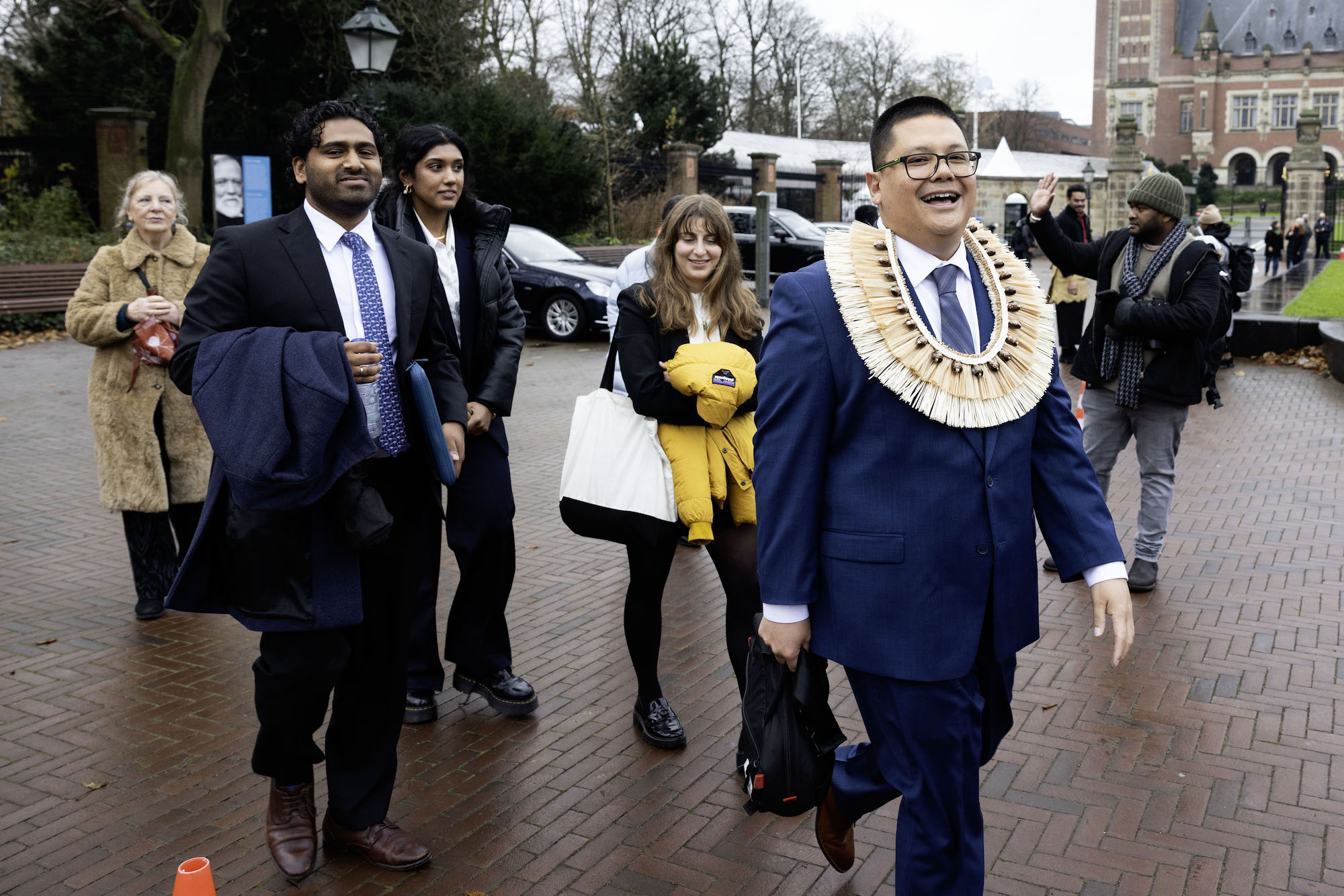 Julian Aguon and his colleagues walk outside of the Peace Palace in The Hague after arguing the world’s biggest climate case. Michel Porro / Getty Images