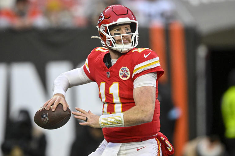 Kansas City Chiefs quarterback Carson Wentz (11) passes in the pocket against the Cleveland Browns during the second half of an NFL football game, Sunday, Dec. 15, 2024, in Cleveland. (AP Photo/David Richard)