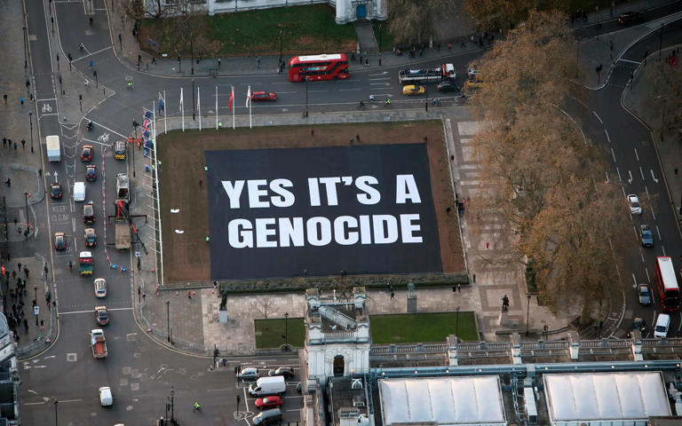 The huge banner was laid out in Parliament Square - Jiri Rezac