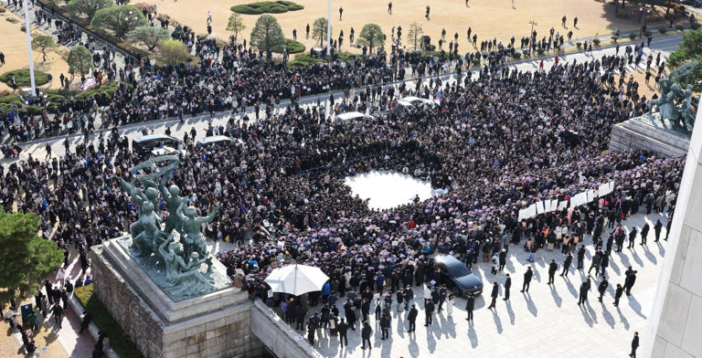 Opposition lawmakers and members of a civic organization take part in a rally in front of the National Assembly in Seoul, demanding South Korean President Yoon Suk Yeol resign over his declaration of emergency martial law, which he revoked hours later. -/YNA/dpa