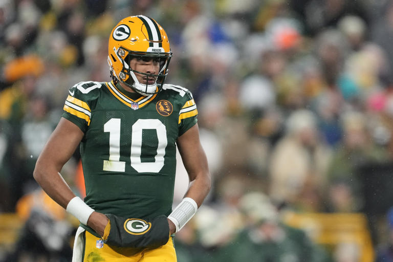 GREEN BAY, WISCONSIN - NOVEMBER 28: Jordan Love #10 of the Green Bay Packers in action against the Miami Dolphins during the third quarter at Lambeau Field on November 28, 2024 in Green Bay, Wisconsin. Packers QB Jordan Love nearly pranked into paying for massive bar tab. Patrick McDermott/Getty Images