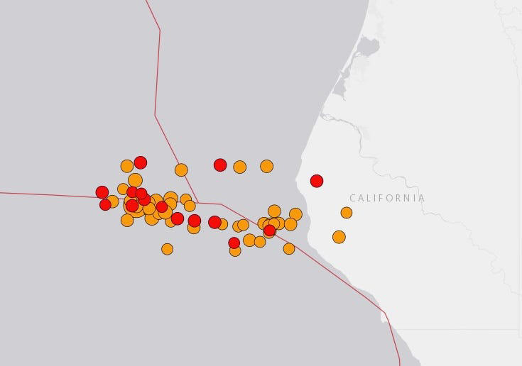 A screenshot from the USGS earthquakes map shows dozens of aftershocks clustered around the 7.0 earthquake on Thursday, as of 3:40 p.m. Pacific Time. USGS/Esri/HERE/Garmin/© OpenStreetMap contributors/the GIS user community