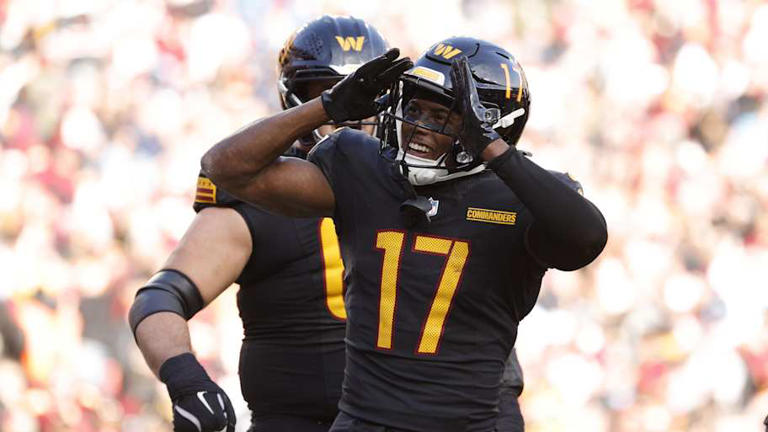 Dec 1, 2024; Landover, Maryland, USA; Washington Commanders wide receiver Terry McLaurin (17) celebrates with fans in the stands after scoring a touchdown against Tennessee Titans during the first half at Northwest Stadium. Mandatory Credit: Amber Searls-Imagn Images | Amber Searls-Imagn Images