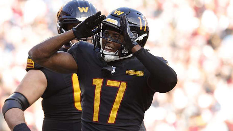 Dec 1, 2024; Landover, Maryland, USA; Washington Commanders wide receiver Terry McLaurin (17) celebrates with fans in the stands after scoring a touchdown against Tennessee Titans during the first half at Northwest Stadium. Mandatory Credit: Amber Searls-Imagn Images | Amber Searls-Imagn Images