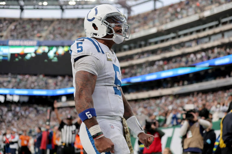 Nov 17, 2024; East Rutherford, New Jersey, USA; Indianapolis Colts quarterback Anthony Richardson (5) celebrates his touchdown against the New York Jets during the fourth quarter at MetLife Stadium. Mandatory Credit: Brad Penner-Imagn Images