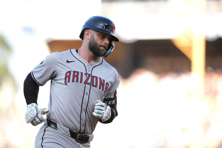 LOS ANGELES, CALIFORNIA - JULY 04: Christian Walker #53 of the Arizona Diamondbacks rounds the bases on a solo home run against the Los Angeles Dodgers during the first inning at Dodger Stadium on July 04, 2024 in Los Angeles, California. Michael Owens/Getty Images