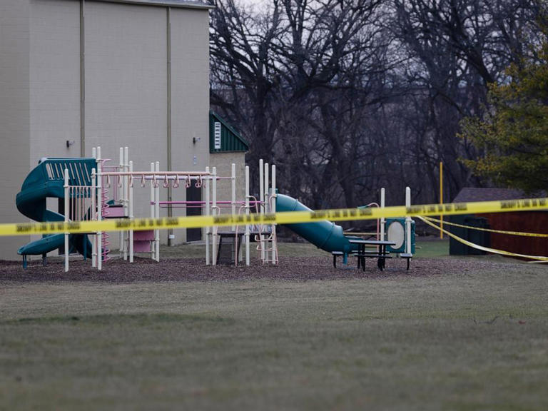 Crime scene tape remains stretched around Abundant Life Christian School as police continue the investigation into Dec. 16 shooting on Dec. 17, 2024 in Madison, Wisc.