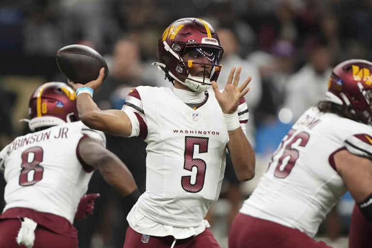 Washington Commanders quarterback Jayden Daniels (5) sets back to pass the ball in the first half of an NFL football game against the New Orleans Saints in New Orleans, Sunday, Dec. 15, 2024. (AP Photo/Gerald Herbert)