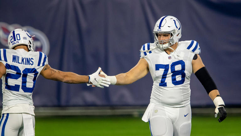 Center Ryan Kelly (78) of the Indianapolis Colts gets a slap from teammate running back Jordan Wilkins (20) of the Indianapolis Colts during warmups, Indianapolis Colts at Tennessee Titans, Nissan Stadium, Nashville, Thursday, Nov. 12, 2020.