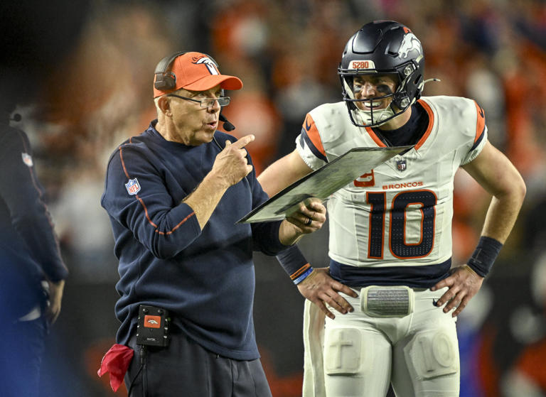 Bo Nix (10) of the Denver Broncos awaits the extra point call from head coach Sean Payton after hitting Marvin Mims Jr. (19) for a touchdown during the fourth quarter of the Cincinnati Bengals’ 30-24 win at Paycor Stadium in Cincinnati, Ohio on Saturday, Dec. 28, 2024.