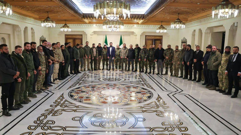 Leaders of the revolutionary factions participate in a meeting with the leader of the new Syrian administration Ahmed al-Sharaa. -/APA Images via ZUMA Press Wire/dpa