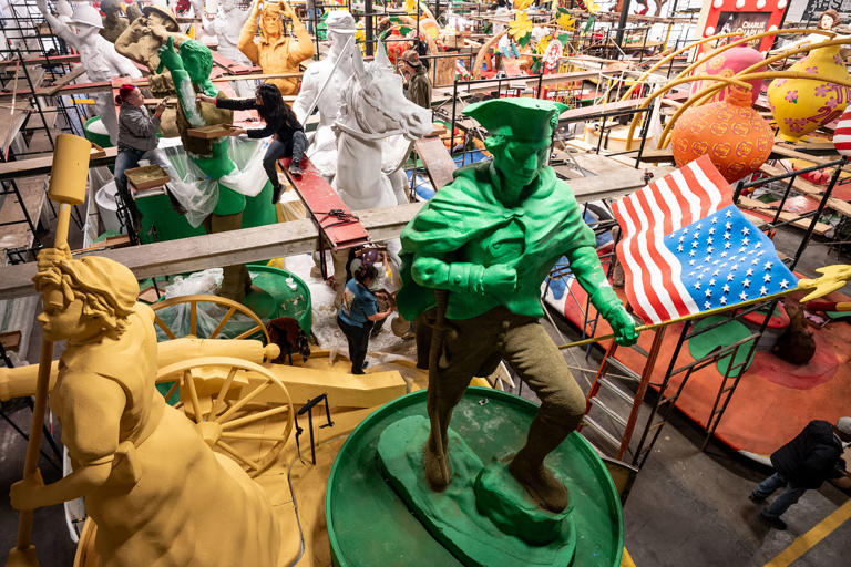 Volunteers prepare the "U.S. Army" float on Dec. 26 for the parade.