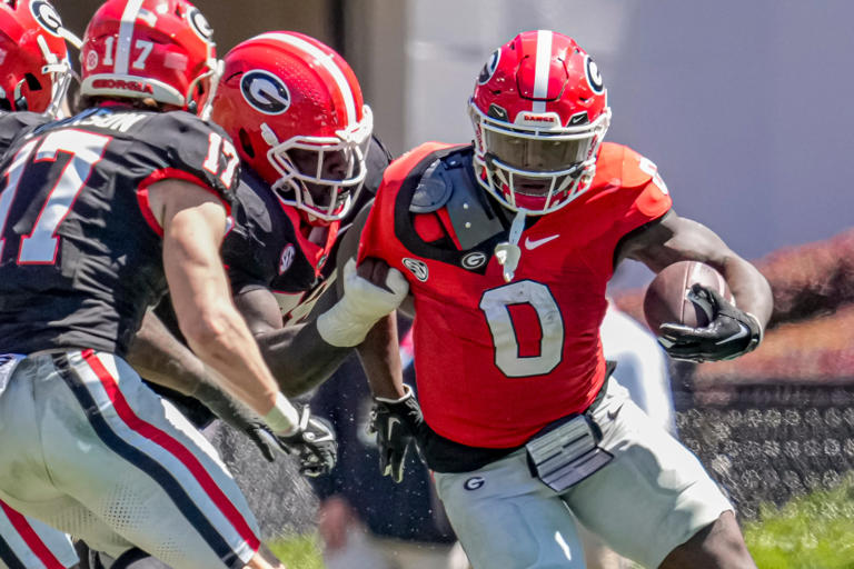 Apr 13, 2024; Athens, GA, USA; Georgia Bulldogs running back Roderick Robinson II runs against defensive lineman Nazir Stackhouse (78) during the G-Day Game at Sanford Stadium. Mandatory Credit: Dale Zanine-USA TODAY Sports