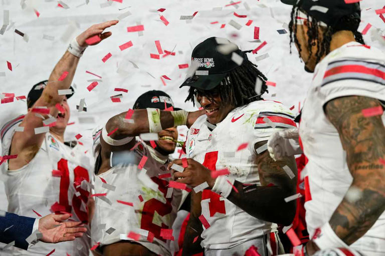 Teammates celebrate as Ohio State Buckeyes WR Jeremiah Smith (4) is named the Rose Bowl Offensive MVP. Adam Cairns/Columbus Dispatch / USA TODAY NETWORK via Imagn Images