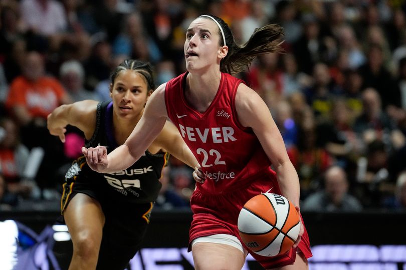 Caitlin Clark #22 of the Indiana Fever drives against Veronica Burton #22 of the Connecticut Sun during the third quarter of Game Two of the 2024 WNBA Playoffs first round at Mohegan Sun Arena on September 25, 2024 in Uncasville, Connecticut.