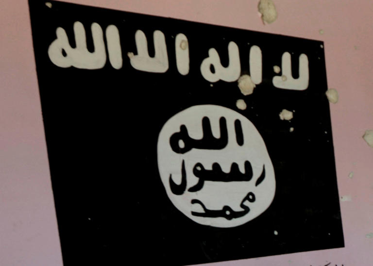 A wall painting can be seen of the ISIS flag at a former Islamic State base in the Syrian city of al-Bab, Syria September 19, 2017.