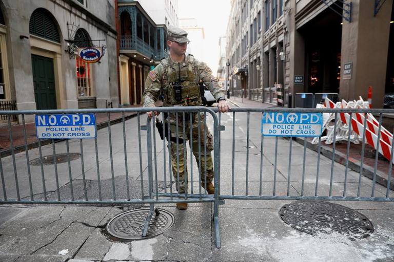 A member of the National Guard Military Police stands, in the area where people were killed by a man driving a truck in an attack during New Year's celebrations, in New Orleans, Louisiana, U.S., January 2, 2025. REUTERS/Octavio Jones