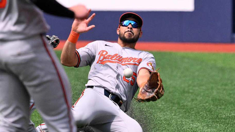 Baltimore Orioles right fielder Anthony Santander (25) fails to catch a bloop double hit by Toronto Blue Jays center fielder Daulton Varsho (not shown) in the fourth inning at Rogers Centre on June 6, 2024. | Dan Hamilton-Imagn Images