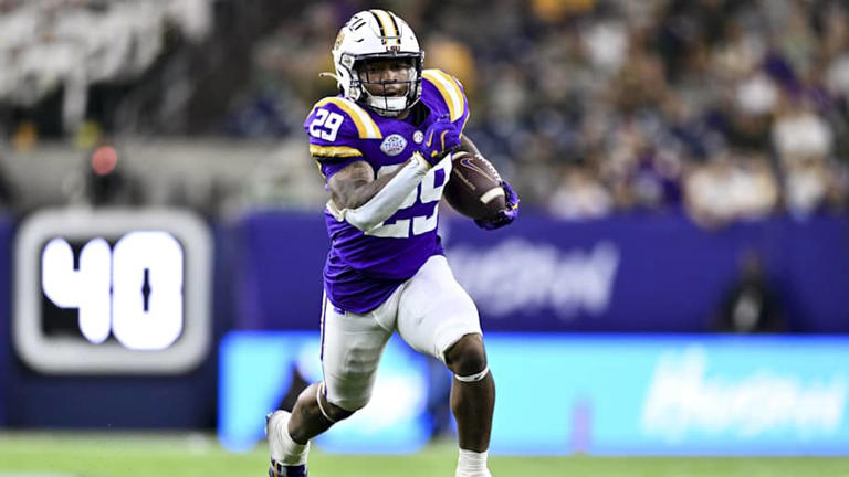 Dec 31, 2024; Houston, TX, USA; LSU Tigers running back Caden Durham (29) runs the ball during the second half against the Baylor Bears at NRG Stadium. The Tigers defeat the Bears 44-31. Mandatory Credit: Maria Lysaker-Imagn Images | Maria Lysaker-Imagn Images