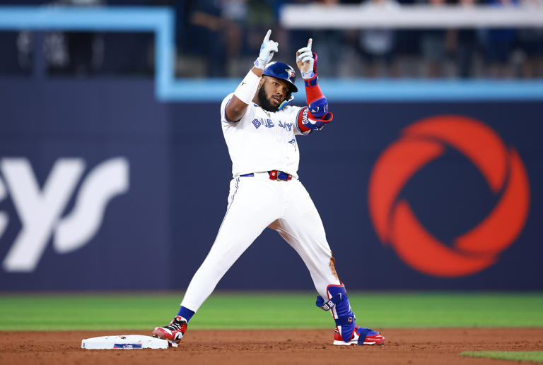 TORONTO, ON - JUNE 29: Vladimir Guerrero Jr. #27 of the Toronto Blue Jays celebrates after hitting an RBI double in the eighth inning during a game against the New York Yankees at Rogers Centre on June 29, 2024 in Toronto, Ontario, Canada. Vaughn Ridley/Getty Images