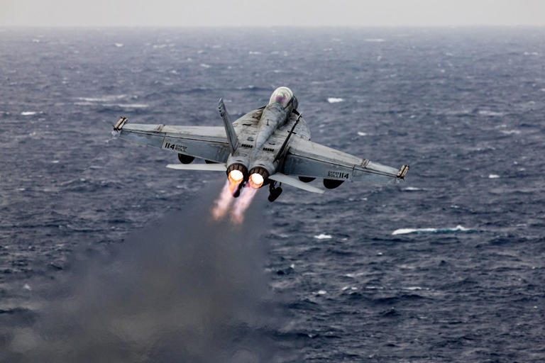 An F/A-18 Super Hornet fighter jet takes off from the flight deck of the USS Dwight D. Eisenhower (CVN 69) aircraft carrier during operations in the southern Red Sea. (Photo: Christopher Pike/ Bloomberg via Getty Images