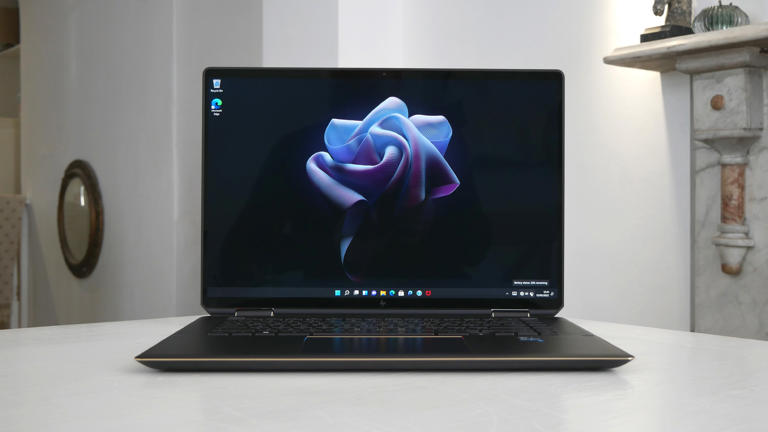 The best place to use a laptop, such as this HP Spectre x360 16 2-in-1, is placed on a flat, hard surface (Image credit: Future)