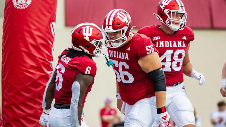 Indiana Hoosiers running back Justice Ellison (6) celebrates his touchdown with Indiana Hoosiers offensive lineman Mike Katic (56) in the first quarter against the Western Illinois Leathernecks at Memorial Stadium. | Trevor Ruszkowski-Imagn Images