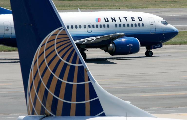 A body was found inside the wheel well of a United Airlines flight from Chicago to Maui on Tuesday