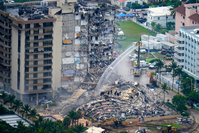 Rescue personnel work at the remains of the Champlain Towers South condo building, June 25, 2021, in Surfside, Florida (Copyright 2021 The Associated Press. All rights reserved.)