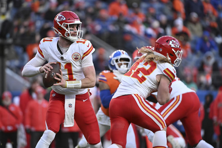 Kansas City Chiefs quarterback Carson Wentz (11) drops back to pass during the second half of an NFL football game against the Denver Broncos Sunday, Jan. 5, 2025, in Denver. (AP Photo/Geneva Heffernan)