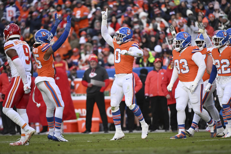 Denver Broncos outside linebacker Jonathon Cooper (0) celebrates after sacking Kansas City Chiefs quarterback Carson Wentz during the first half of an NFL football game Sunday, Jan. 5, 2025, in Denver. (AP Photo/Geneva Heffernan)