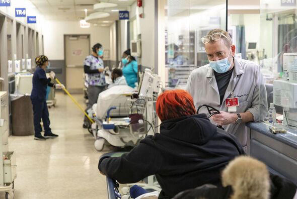 patients being seen in a hospital corridor