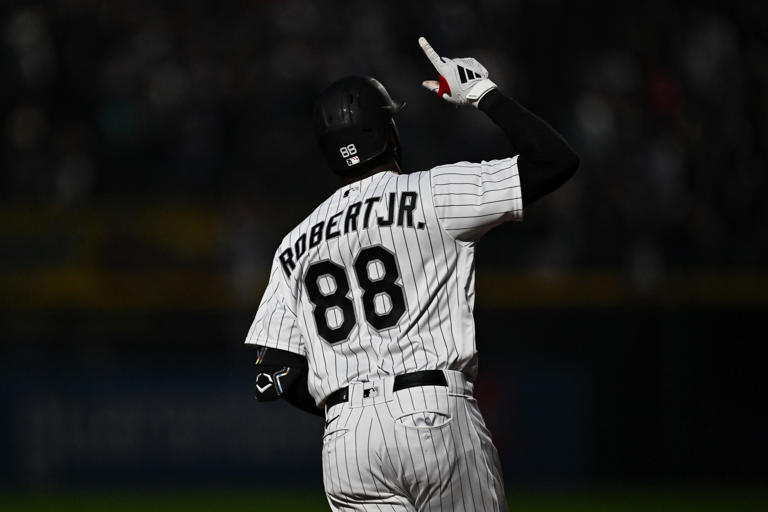 CHICAGO, IL - JULY 04: Luis Robert Jr. #88 of the Chicago White Sox celebrates while rounding the bases after hitting a three-run home run in the sixth inning against the Toronto Blue Jays at Guaranteed Rate Field on July 4, 2023 in Chicago, Illinois. Jamie Sabau/Getty Images