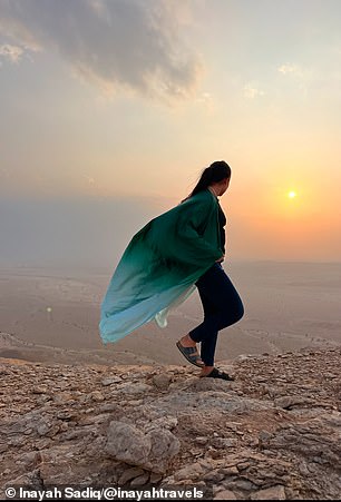 Inayah says she'd highly recommend visiting Saudi Arabia. She's pictured at the Edge of the World viewpoint, around 100km from the capital, Riyadh