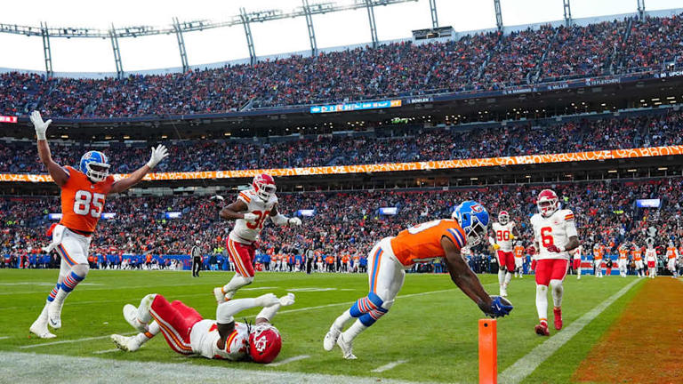 Jan 5, 2025; Denver, Colorado, USA; Denver Broncos wide receiver Marvin Mims Jr. (19) scores a touchdown in the second half against the Kansas City Chiefs at Empower Field at Mile High. Mandatory Credit: Ron Chenoy-Imagn Images | Ron Chenoy-Imagn Images