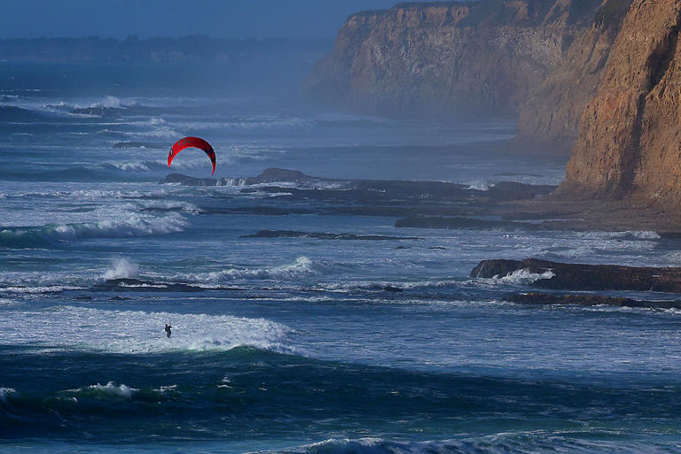 Photo | Kitesurfer takes advantage of strong wind at Scott Creek Beach