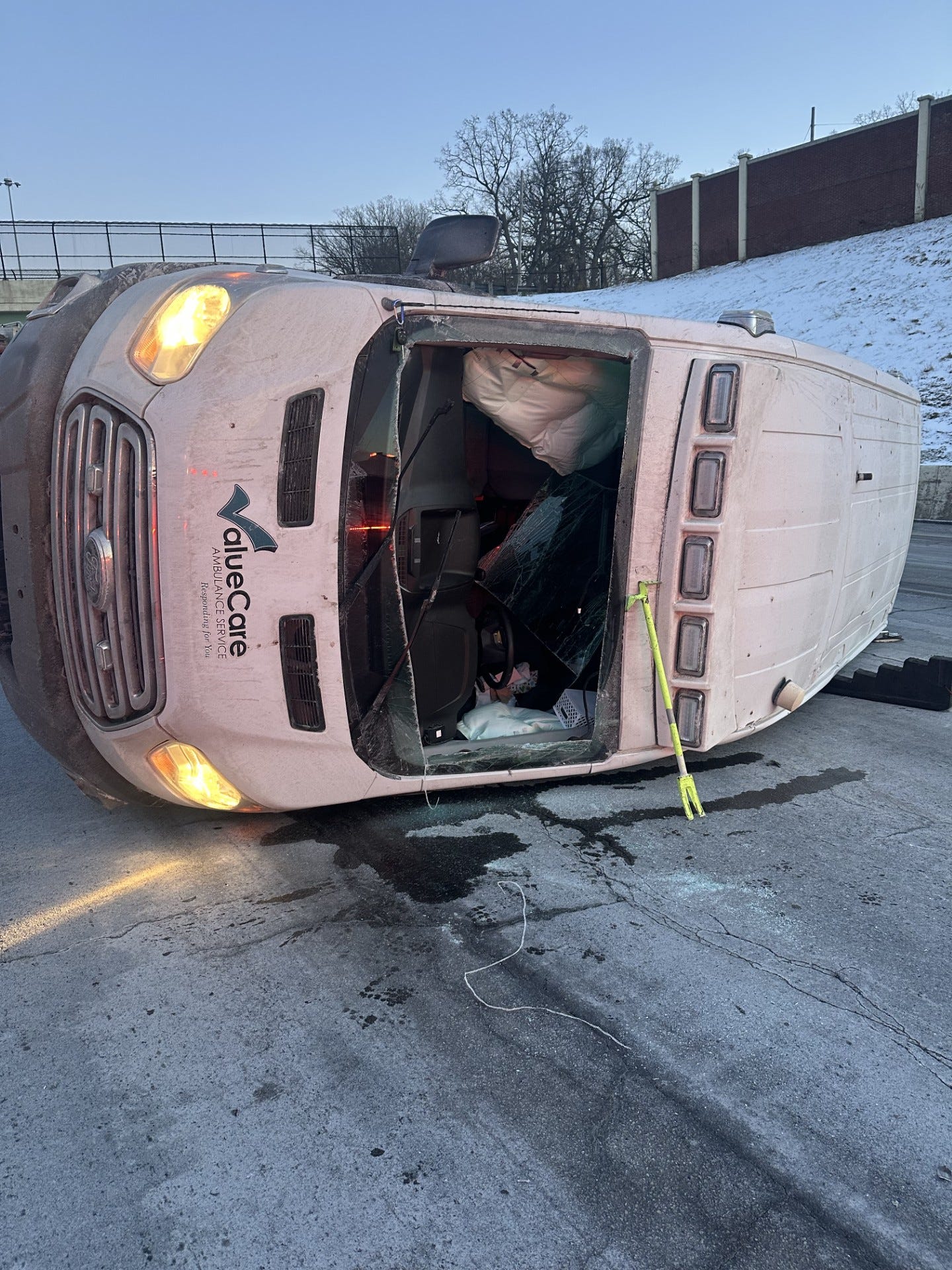 Ambulance overturns on I77 in Canton, driver removed through