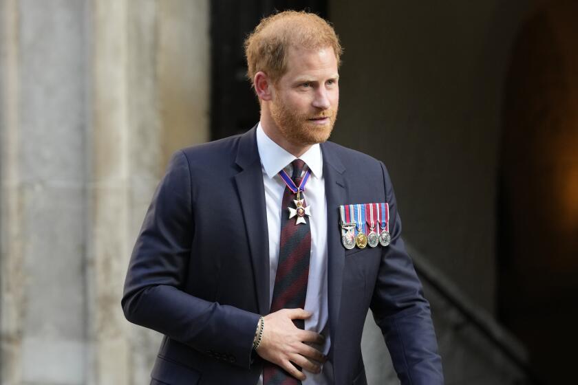Prince Harry reaches settlement with Murdoch's UK tabloids. They