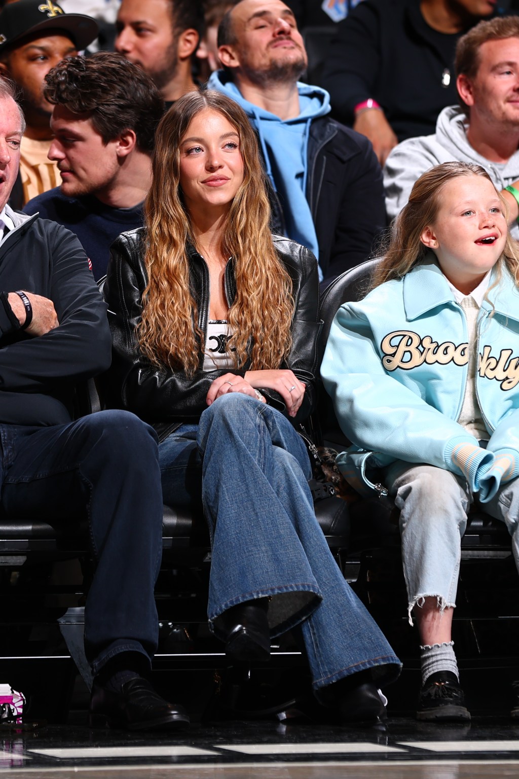 Sydney Sweeney sits courtside in 790 sequined tank top at game(02)