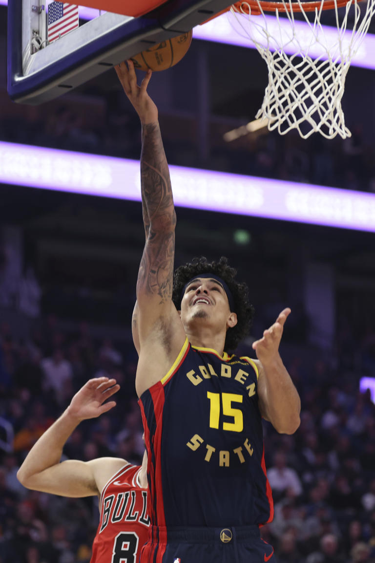 Golden State Warriors forward Gui Santos (15) shoots against Chicago Bulls guard Zach LaVine (8) during the first half of an NBA basketball game in San Francisco, Thursday, Jan. 23, 2025. (AP Photo/Jed Jacobsohn)