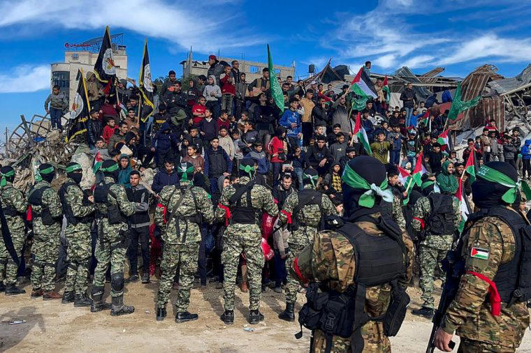 Hamas fighters and locals gather at the square in Gaza City (Photo: AFP)