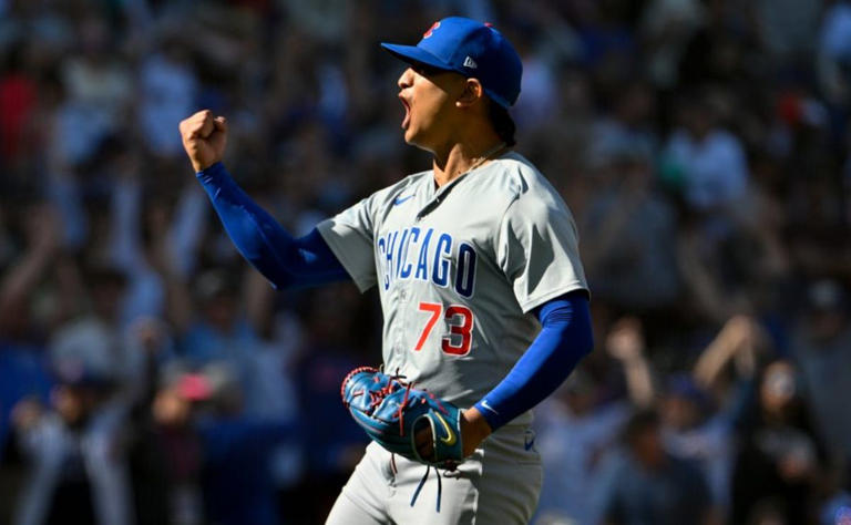 Pitcher Adbert Alzolay #73 of the Chicago Cubs reacts after picking off Julio Rodriguez of the Seattle Mariners at first base in the bottom of the ninth inning to end the game at T-Mobile Park on April 14, 2024 in Seattle, Washington. (Photo by Alika Jenner/Getty Images)