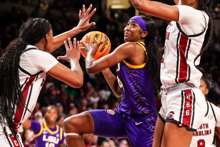 Jan 24, 2025; Columbia, South Carolina, USA; LSU Lady Tigers guard Flau'Jae Johnson (4) drives against the South Carolina Gamecocks in the second half at Colonial Life Arena. Mandatory Credit: Jeff Blake-Imagn Images