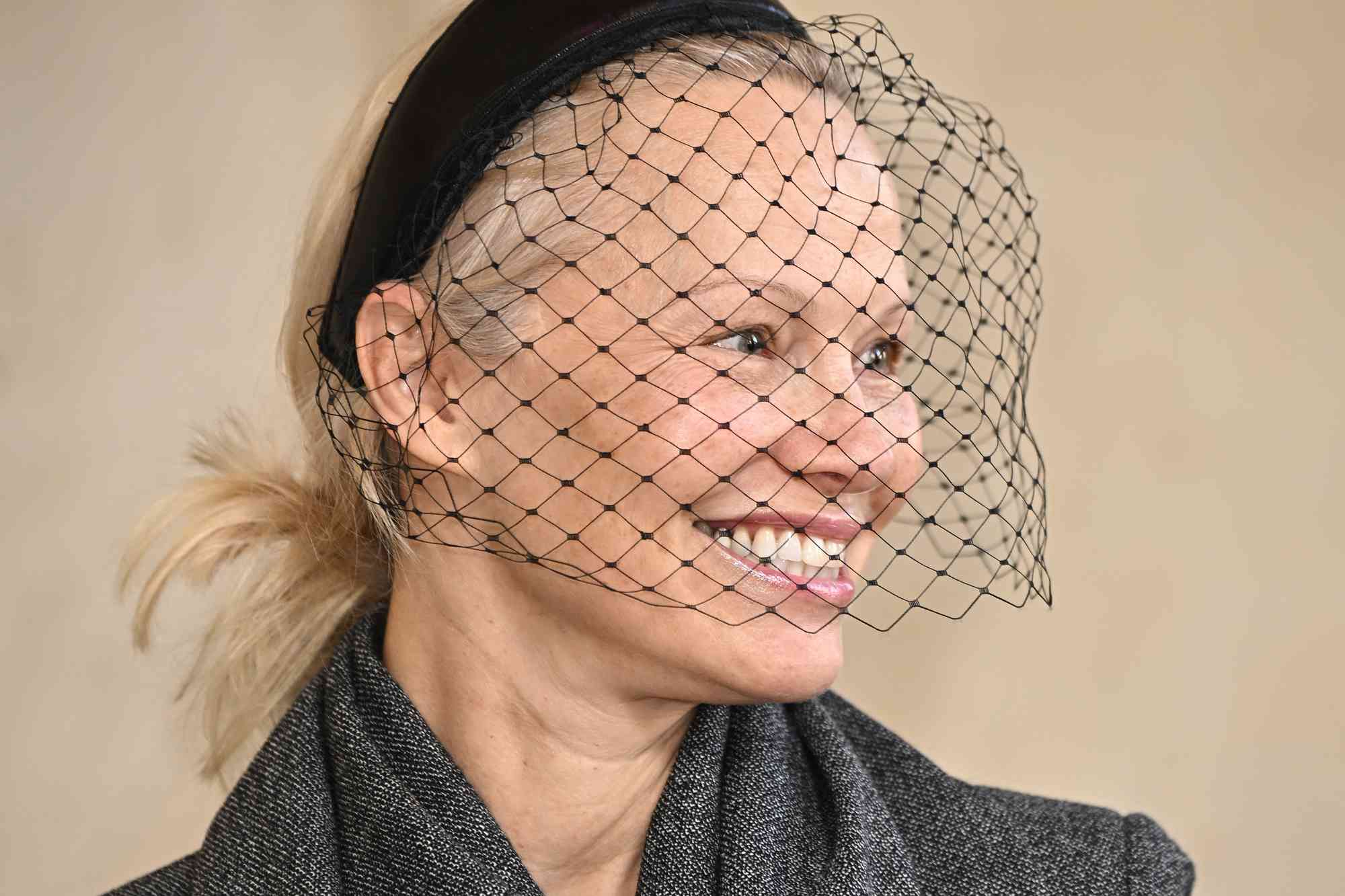 Pamela Anderson Glows with Barefaced Complexion Under Retro Veiled