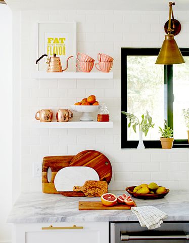 Kitchen with white shelves with décor